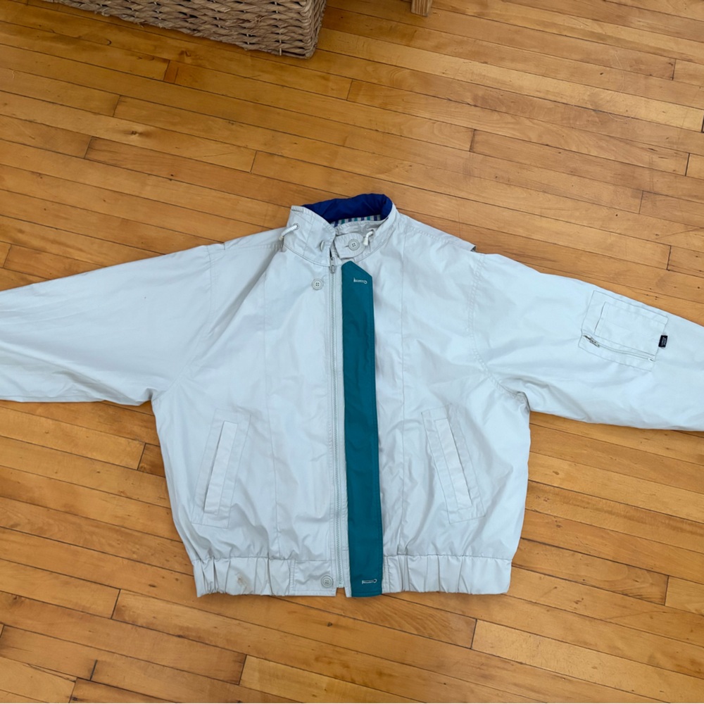 London Fog Tan Jacket with White and Teal design on the inside.
